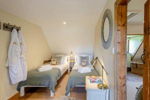 Voodi või voodid majutusasutuse Fox Cottage toas