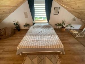 Postel nebo postele na pokoji v ubytování LilHouse loftas Šiauliuose + 11 fotografií
