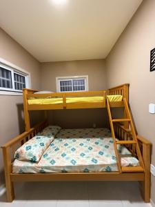 Ένα ή περισσότερα κρεβάτια σε δωμάτιο στο Residencial Portela 08C