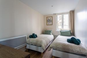 Ένα ή περισσότερα κρεβάτια σε δωμάτιο στο Logement moderne, luxueux, Hyper centre