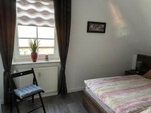 Postel nebo postele na pokoji v ubytování Quartier 23