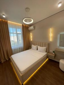 Katil atau katil-katil dalam bilik di ЖК Dostar Modern Comfort