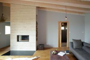 a living room with a couch and a fireplace at Chata Nola Slapy in Křečovice