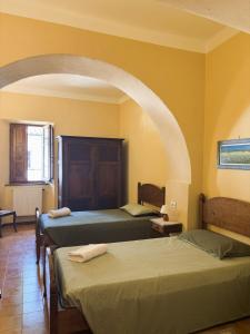 Ένα ή περισσότερα κρεβάτια σε δωμάτιο στο Convento del Carmine 4 +4 φωτογραφίες