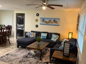a living room with a couch and a table at Beach House in Largo
