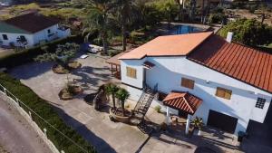an aerial view of a white house with a red roof at Villa Vic in Grao de Castellón