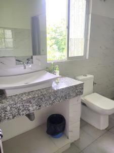 a bathroom with a sink and a toilet at Viki homestay in Dimapur