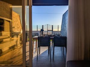 Μπαλκόνι ή βεράντα στο Residencial Perequê - Frente Mar com Conforto Acústico
