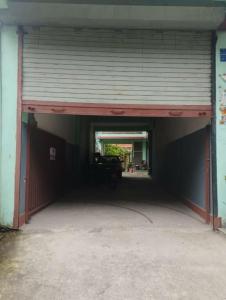 a garage with a car parked inside of it at Shree Muktinath Hotel in Pokhara