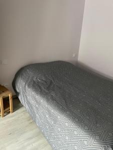 Ένα ή περισσότερα κρεβάτια σε δωμάτιο στο Maison à la campagne