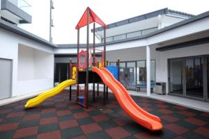 a playground with a slide in a building at Palas Horizon Home A-6-15 in Brinchang