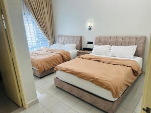 Postel nebo postele na pokoji v ubytování Home In Tampin + 14 fotografií