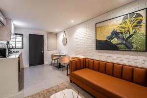 a living room with a couch against a brick wall at Backyard in Lagos