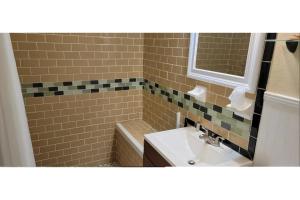 a bathroom with a sink and a mirror at Siesta Motor Inn By Townhouse Kennedy Space Center Titusville I 95 in Titusville +22 photos