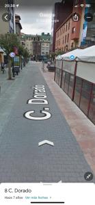 a street with the number five written on the sidewalk at Esther in Langreo