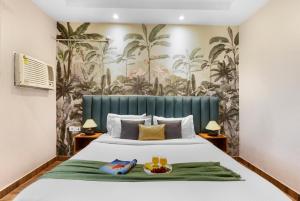a bedroom with a bed with a green headboard at Krishna Manor 3-BHK Farmhouse With Private Pool & Lush Garden Near Noida Expressway in Noida +47 photos