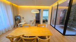 a dining table and chairs in a living room at A Bridge House 2A-1 in Jung-gu +2 photos