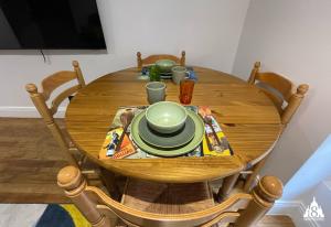 a wooden dining room table with a bowl and plates on it at 18 Montmartre in Paris