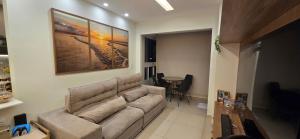 a living room with a couch and a table at Belém COP30 Apartment in Belém