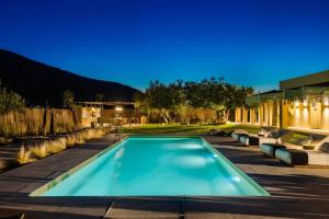 a swimming pool in the backyard of a house at The Attican Villa & Estate in Anavissos