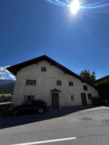 a building with a car parked in front of it at Nynke's AlpenNest in Arzl im Pitztal