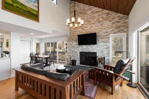a living room with a couch and a fireplace at Ledges 78 with Wintergreen Advantage in Wintergreen