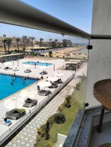 Bazén v ubytování Scandic resort سكاندك nebo v jeho okolí