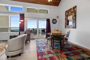 a living room with a table and chairs at Ledges 72 with Wintergreen Advantage in Wintergreen