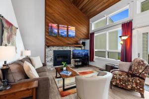 a living room with a couch and a fireplace at Ledges 72 with Wintergreen Advantage in Wintergreen