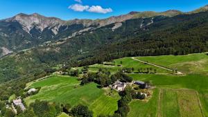 an aerial view of a house in the mountains at Agriturismo Podere Paradiso in Cutigliano