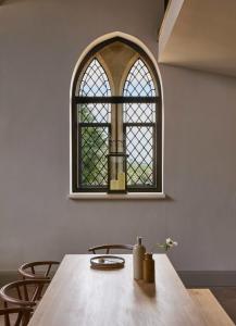 a window in a room with a wooden table at Luxury Cotswolds Retreat nr Estelle Manor  +30 photos
