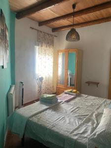 a bedroom with a large bed and a window at house carmen in Villaminaya