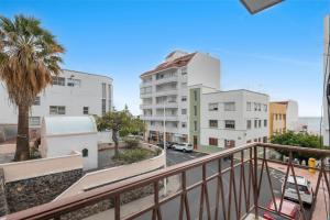 a balcony with a view of a street and buildings at Home Elias La Palma City in Santa Cruz de la Palma