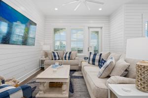 a living room with a couch and a table at Coastal Charm at Palmilla Beach in Port Aransas