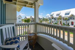 a balcony with chairs and a view of the beach at Coastal Charm at Palmilla Beach in Port Aransas