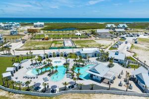 an aerial view of a resort with a pool at Coastal Charm at Palmilla Beach in Port Aransas