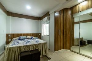 a bedroom with a bed and a walk in shower at COP30-Residência-7 quartos para 2 hóspedes cada in Belém