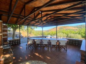 a ping pong table in a room with a view at Dream House in Kavala