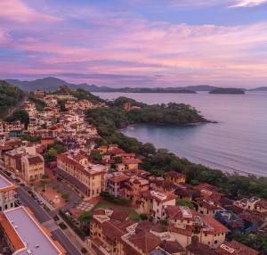 an aerial view of a town next to the water at Las Catalinas Doorway in Playa Flamingo