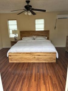 a bedroom with a bed and a ceiling fan at Miami Spacious Executive Suite in Miami