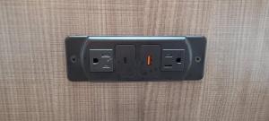 a light switch with an orange light on a wall at Red Roof Inn Charlotte - Airport in Charlotte