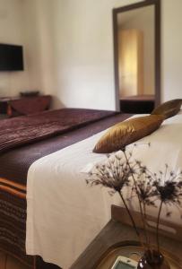 Giường trong phòng chung tại Salvia e Rosmarino - Affittacamere in Liguria