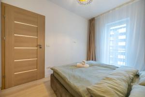 Postel nebo postele na pokoji v ubytování B-House Adora Park