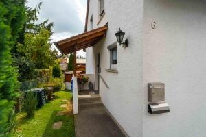 a white building with a light on the side of it at Anita's Fewo in Ulm