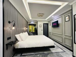 Ένα ή περισσότερα κρεβάτια σε δωμάτιο στο Stay Inn ApartHotel