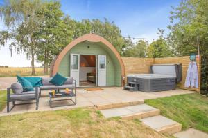 a gazebo with a barbecue in a yard at 1 Bed in Langtoft oc-l32680 in Langtoft +9 photos