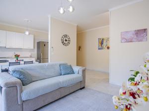 a living room with a couch and a kitchen at Casa Bellavista in SantʼAntonio Abate