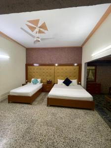 Ένα ή περισσότερα κρεβάτια σε δωμάτιο στο Rehaish Inn Guest House