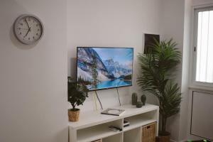 a flat screen tv sitting on top of a white shelf at Brisa del Mar in Tacoronte