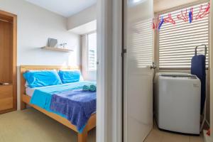 Ένα ή περισσότερα κρεβάτια σε δωμάτιο στο IT Park Deluxe 1.5 bedrooms apartment
